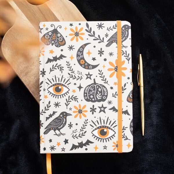 Caderno A5 Frightful Folk com design de tradições populares e capa decorada