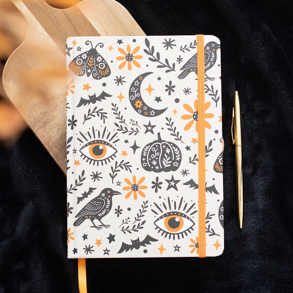 Caderno A5 Frightful Folk com design de tradições populares e capa decorada