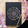 Caderno A5 Roda do Ano com capa decorada com os oito festivais sagrados
